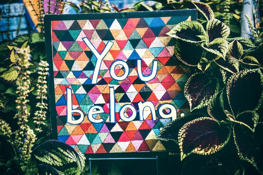 photo of multicolored quilt with the words "you belong"